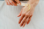 An image to show our Calm and Cleanse balm spread on a hand. Creamy, balmy consistency. Plant based beauty. Vegan skincare. Vegan beauty. Salt & Clay. Hampshire. 