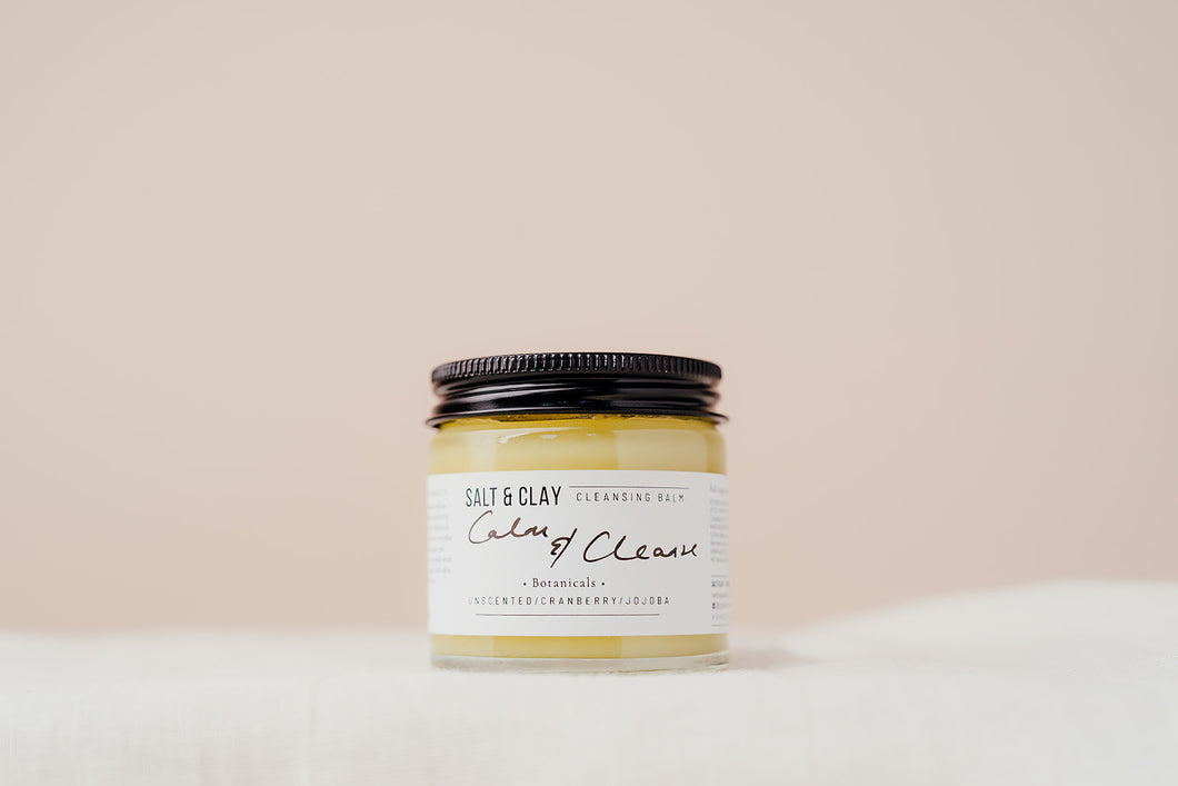 Our best selling Calm and Cleanse cleansing balm featuring nourishing and soothing butters and oils. Unscented. Plant based beauty. Vegan skincare. Vegan beauty. Salt & Clay. 