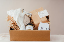Load image into Gallery viewer, Salt &amp; Clay gift kit. This is our Bare gift kit which features our unscented products. A white face cloth, Bare soap slice, Coconut fizzing bath block and Oat and Apricot scrub.Vegan skincare. Salt &amp; Clay. Hampshire UK.
