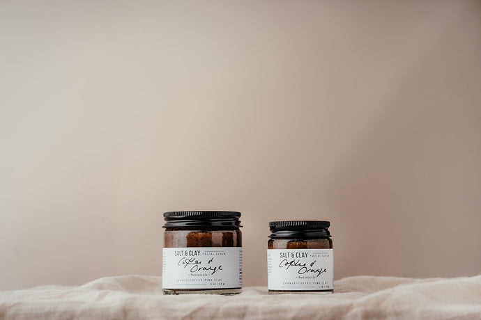 Coffee and orange face scrub made by Salt and Clay. Packaged in a recycled glass jar with a recyclable aluminium lid. Vegan friendly skincare.  